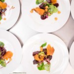 Plated field greens salad prepared by The Painted Table catering team