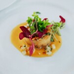 Scallop appetizer with micro greens