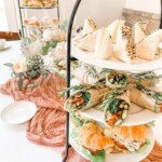 High tea sandwiches presented on a three-tier stand for a home drop-off catering event