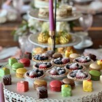 Dessert display with fruit tarts, macarons, and petit fours for a high tea event