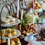 High tea table display featuring finger sandwiches and assorted pastries